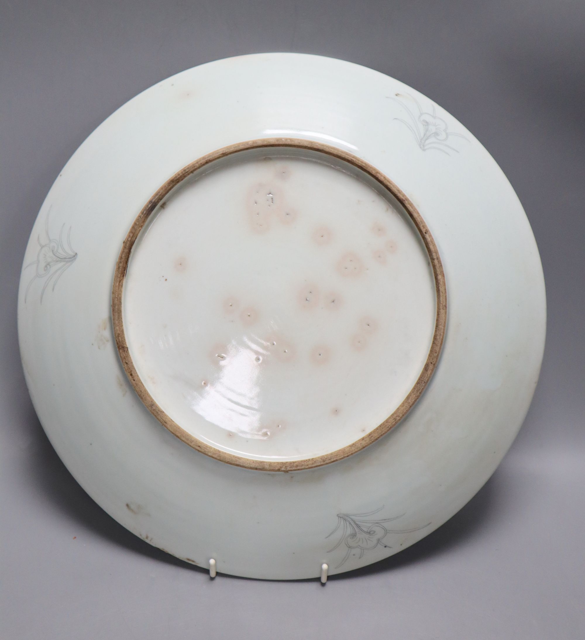 A Chinese porcelain dish engraved with horses, rocks and pine, diameter 33.5cm